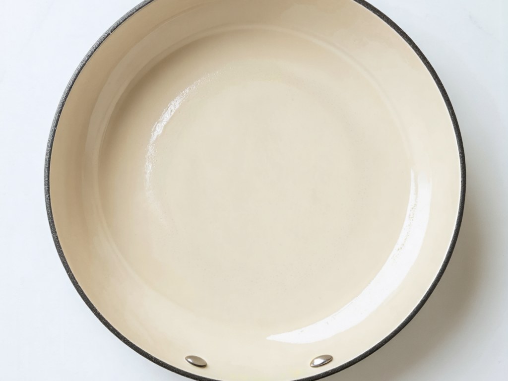 Ceramic nonstick pan interior with smooth cream-colored sol-gel cooking surface